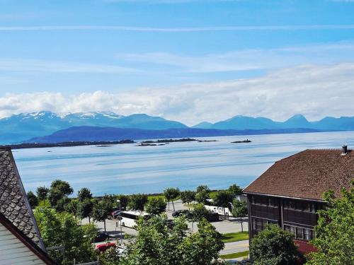 a view of a large body of water with mountains at Sentrumsidyll ved fjord og fjell in Molde