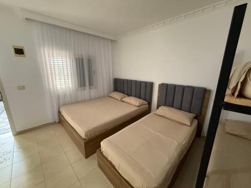 Katil atau katil-katil dalam bilik di Private Houses by the Beach