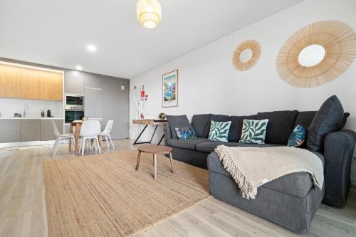 a living room with a couch and a table at MK Apart I in Funchal