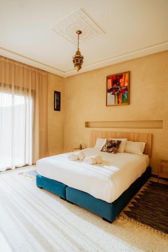 a bedroom with a large bed in a room at The Ocean Surf Villa in Dakhla
