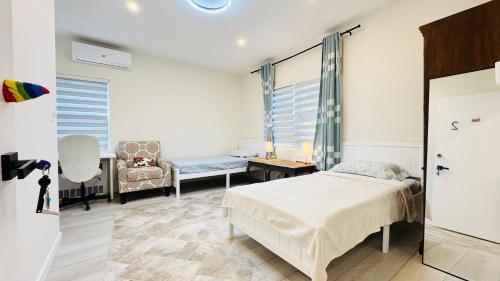 a bedroom with a bed and a chair at Line&Light