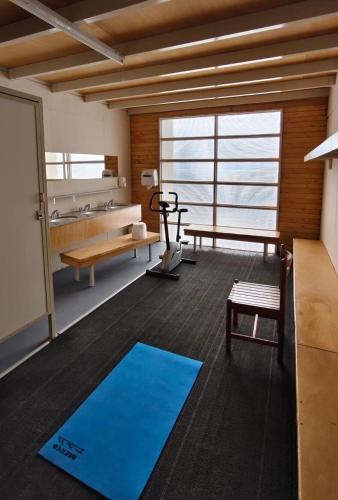 a room with a gym with a blue yoga mat at Apartment in Las Leñas in Las Lenas