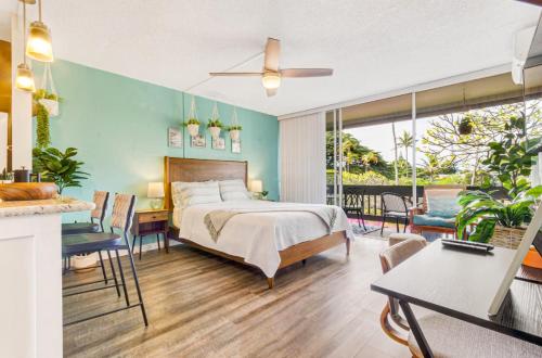 a bedroom with a bed and a table and chairs at Perfect Studio Condo in Kapalua with Ocean View Unit A18 in Kahana