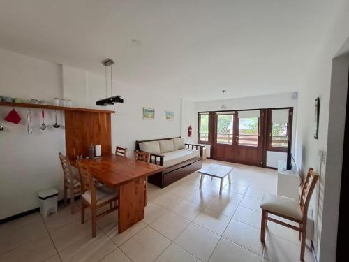 a living room with a wooden table and a couch at Padornelo Sur in San Carlos de Bariloche