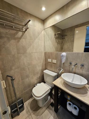 a bathroom with a toilet and a sink at Tempora 621 in Buenos Aires