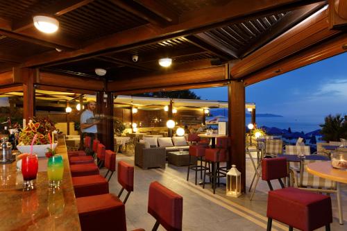 a restaurant with a view of the ocean at Indigo Mare in Plataniás
