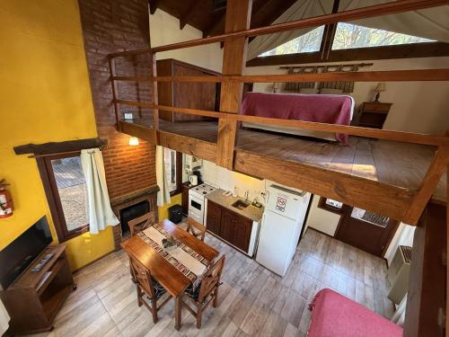 an overhead view of a kitchen and dining room with a loft at Complejo de Cabañas Tunquelen in Mar de las Pampas