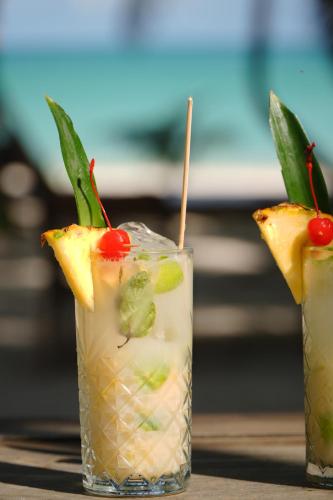 two cocktails sitting on top of a table at Hotel Cielo y Selva in Punta Allen