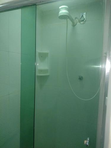 a shower with a glass door in a bathroom at Suíte com a melhor vista de Manaus in Manaus
