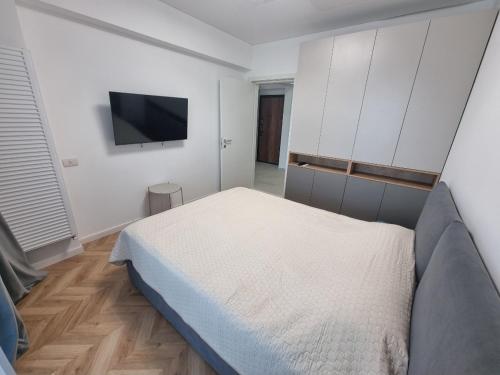 Ένα ή περισσότερα κρεβάτια σε δωμάτιο στο Apartament Stefan
