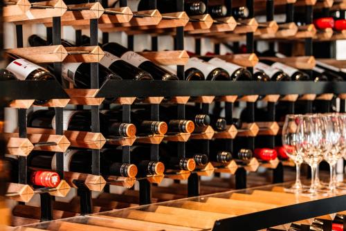 a bunch of wine bottles in a wine cellar at Rydges Resort Hunter Valley in Lovedale
