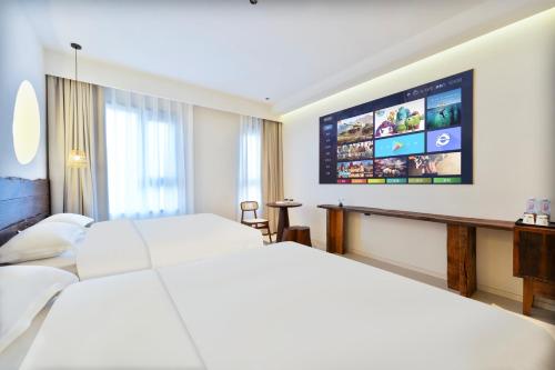 Ein Bett oder Betten in einem Zimmer der Unterkunft Xi'an YOLO Guest House