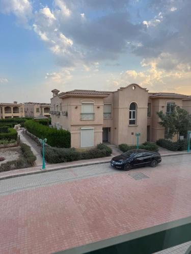a black car parked in front of a house at 3 bedrooms villa in Ain sokhna in Ain Sokhna