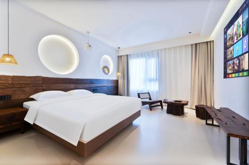 Ein Bett oder Betten in einem Zimmer der Unterkunft Xi'an YOLO Guest House
