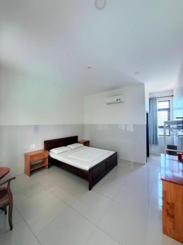 Una cama o camas en una habitación de Bảo Lộc Hotel Lagi