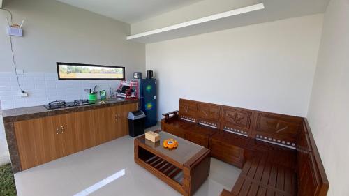a kitchen with a counter and a table in a room at Angkasa Sunrise Villa in Saba