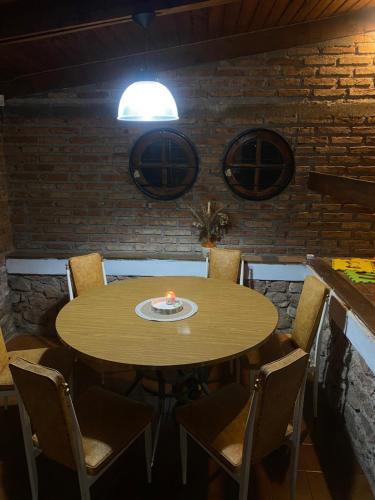 a table in a room with a candle on it at La casa de Pedro in San Roque