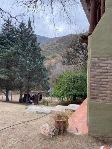 a brick house with a view of a mountain at La casa de Pedro in San Roque