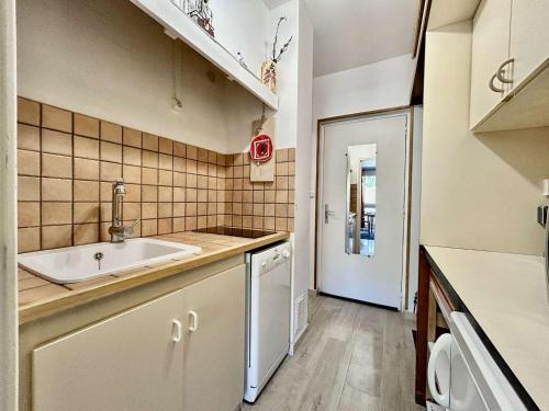 a kitchen with a sink and a dishwasher at Studio 4 pers à SuperDevoluy avec wifi et terrasse - FR-1-525-297 in Superdevoluy