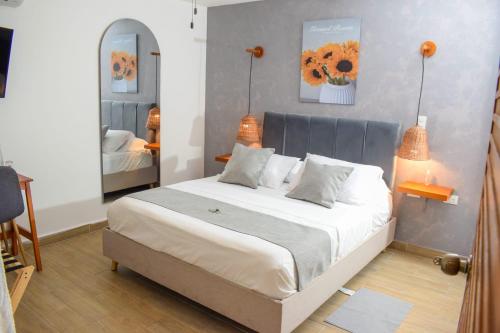 Ένα ή περισσότερα κρεβάτια σε δωμάτιο στο Muguet House Granada