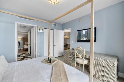 a master bedroom with a bed and a mirror at W hotel High end ocean view 2 bedroom at icon brickell in Miami