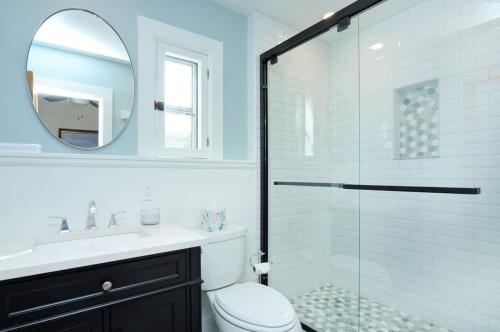 a bathroom with a shower and a toilet and a sink at Salida Terrace House Str#447 in Salida