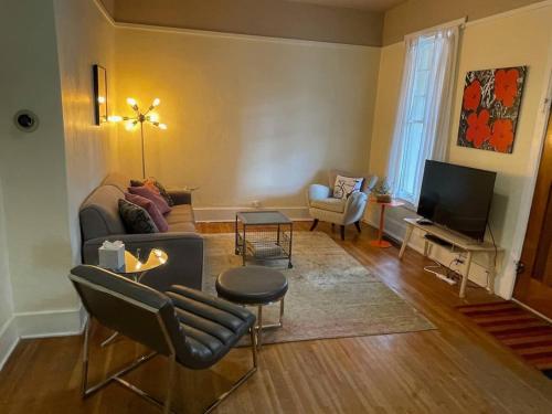 a living room with a couch and a tv at Quaint Home On Alpine Park, Downtn Salida Str461 in Salida
