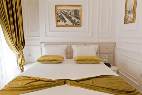 Una cama o camas en una habitación de Eler Hotel