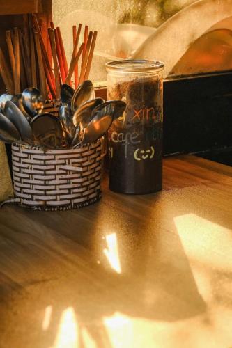 a basket of mussels sitting next to a can of soda at Cú Trên Cây Homestay in Xuan An