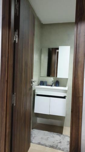 a bathroom with a sink and a white counter top at Wohnung Blick am Meer in Agadir
