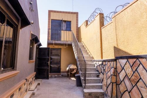a set of stairs leading to a building at JK COZY HOMES ug in Kampala