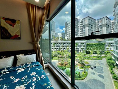 Postel nebo postele na pokoji v ubytování Anna Green Apartment Aeon Tân Phú