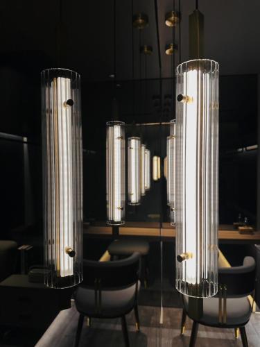 a room with chairs and a table with lights at Here Hotel 宅這兒私宅-屏市A宅 in Pingtung City