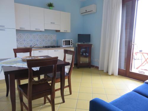 a kitchen and dining room with a table and chairs at Case Vacanze Residence Trinacria in Acireale