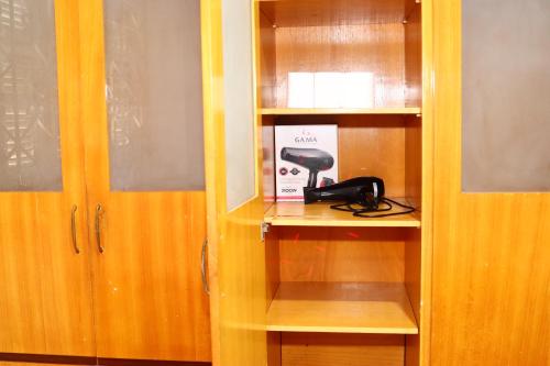 a telephone is sitting on a shelf in a room at Casa no Jardim Renascença- Bird House Renascença in São Luís