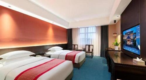 Postel nebo postele na pokoji v ubytování Dengfeng Chanwu Hotel