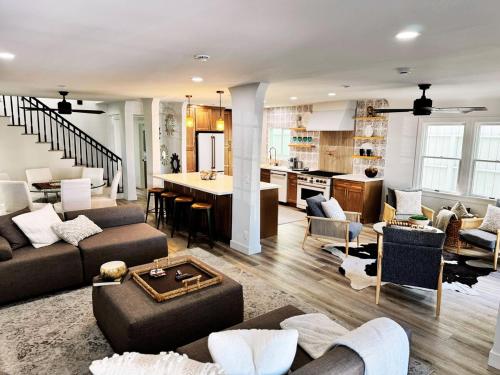 a large living room with a couch and a kitchen at Beach Life in Belmont Shore in Long Beach