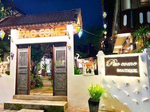a entrance to a shop with a sign on the door at Pao Come Boutique House in Chiang Mai