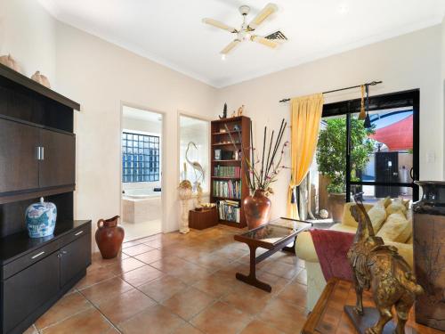 a living room with a couch and a table at Enjoy Between Lake and River in South Yunderup