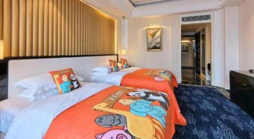 a bedroom with two beds with hello kitty beds at Tongxiang Inspirock Hotel in Jiaxing