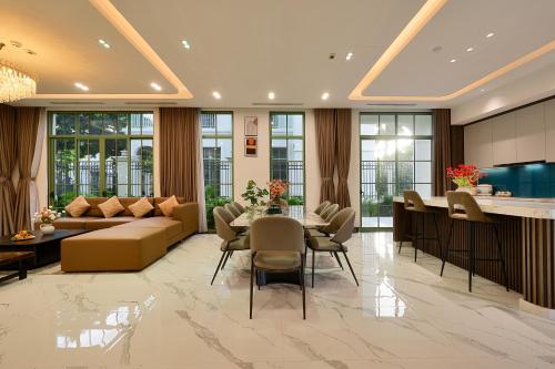 a living room with a couch and a table at La isla Apartments & Villas - Sea View & Fireworks Phu Quoc in Phu Quoc