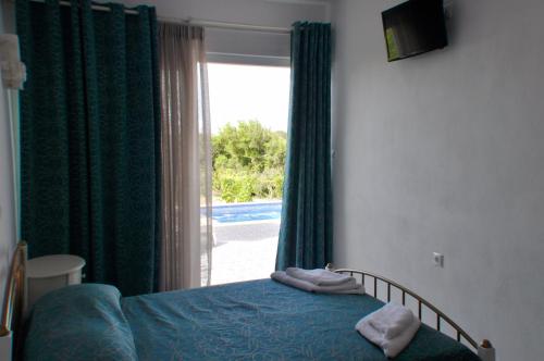 Posteľ alebo postele v izbe v ubytovaní Ariadne House