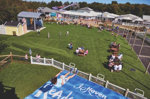 an aerial view of an amusement park with people on a field at KPC-HELLYEAH caravan in Humberston