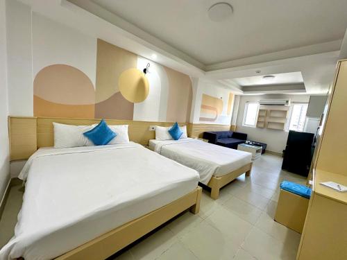 Ένα ή περισσότερα κρεβάτια σε δωμάτιο στο Sea Charm Da Nang