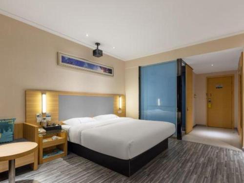Letto o letti in una camera di City Comfort Inn Zhanjiang South Railway Station