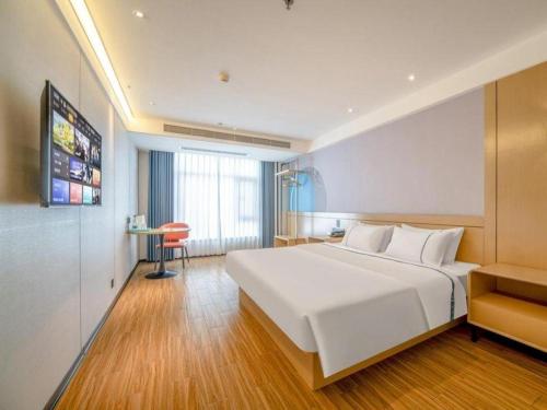 Postel nebo postele na pokoji v ubytování City Comfort Inn Zhanjiang Xuwen Port Wharf Passenger Station
