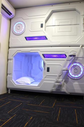 an empty refrigerator with its door open in a room at ORO Hotel Kluang in Kluang