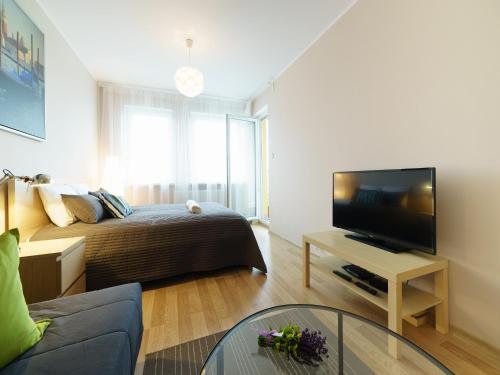TV a/nebo společenská místnost v ubytování Marcelin Apartments Poznań