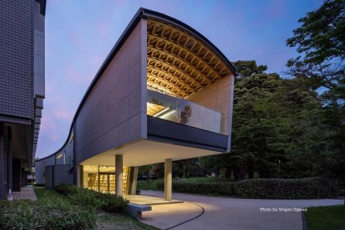 a building with a large window on the side of it at Grids Premium Hotel Kumamoto in Kumamoto