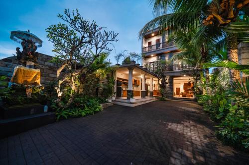an exterior view of a house with a driveway at Oka Suite Sebatu Ubud in Tampaksiring